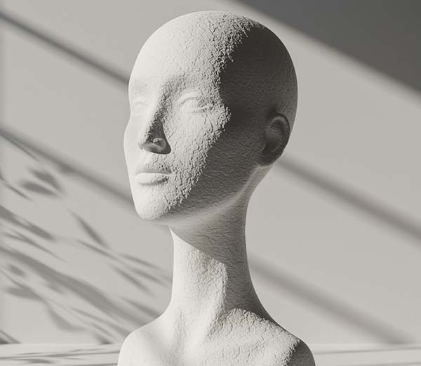 Textured white mannequin head with shadows and soft lighting.